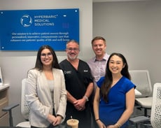Dr. Katz and HMS staff posing in office