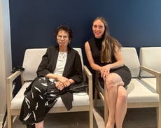 HMS staff posing in office chairs