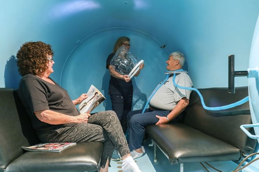 patients getting prepped by nurse in hyperbaric chamber