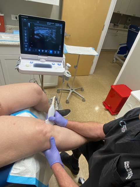 Dr. Katz doing an ultrasound of a knee in preparation for Platelet Rich Plasma