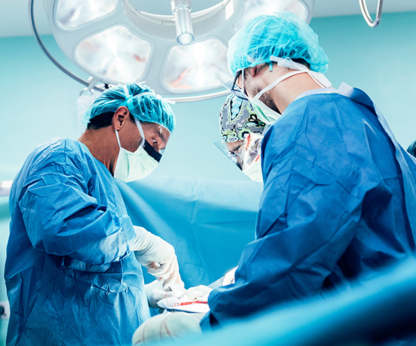 A group of surgeons in an operating room.