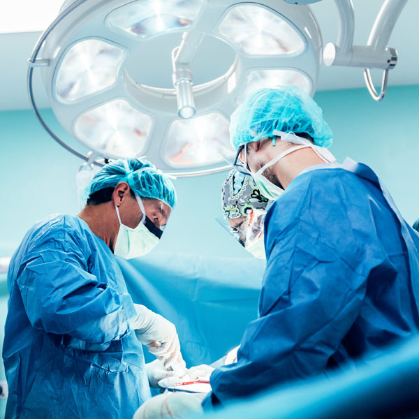 doctors performing surgery doctors performing surgery