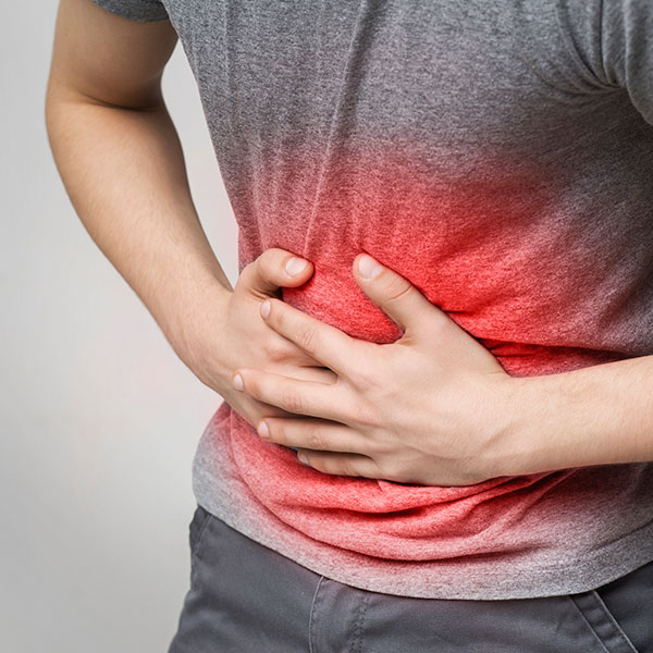 man holding stomach in pain man holding stomach in pain