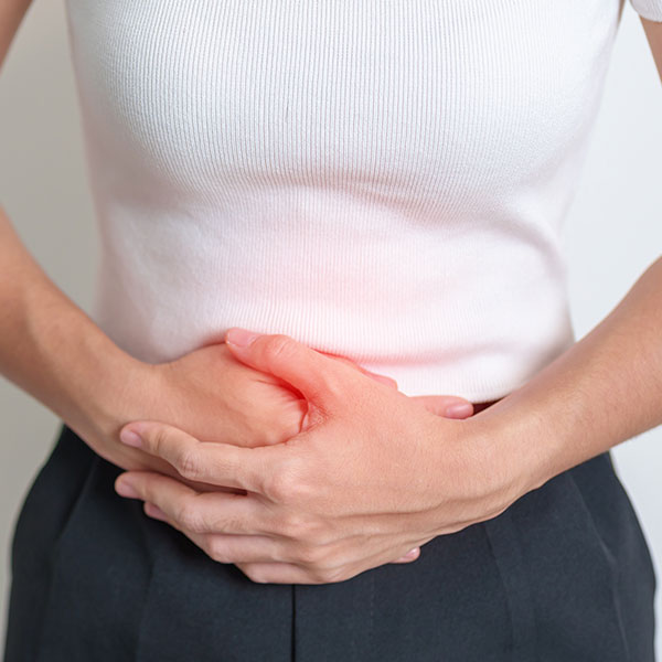 woman holding bladder in pain