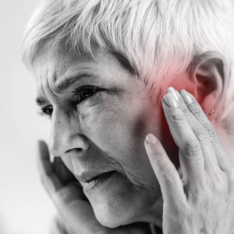 woman suffering from hearing loss